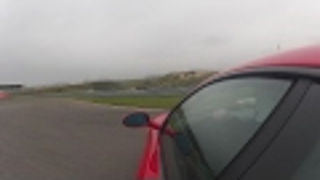 Watch This Ferrari Driver Somehow Avoid A Wet Lap Crash